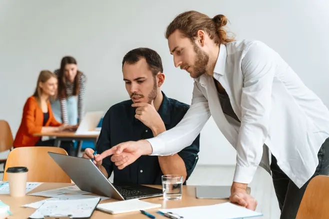 Office workers using laptops